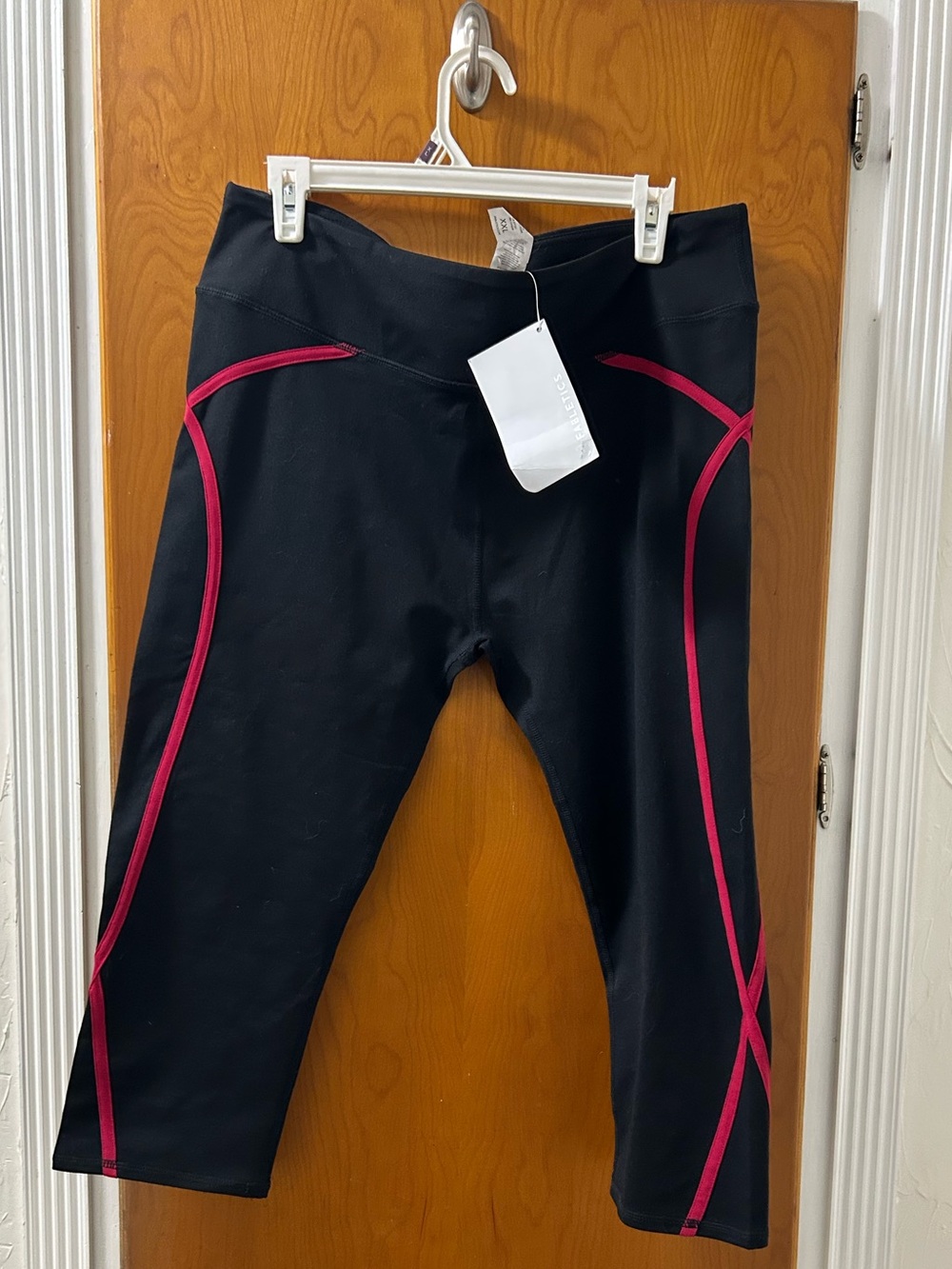 Fabletics Black Capri Leggings with Pink Contrast Piping